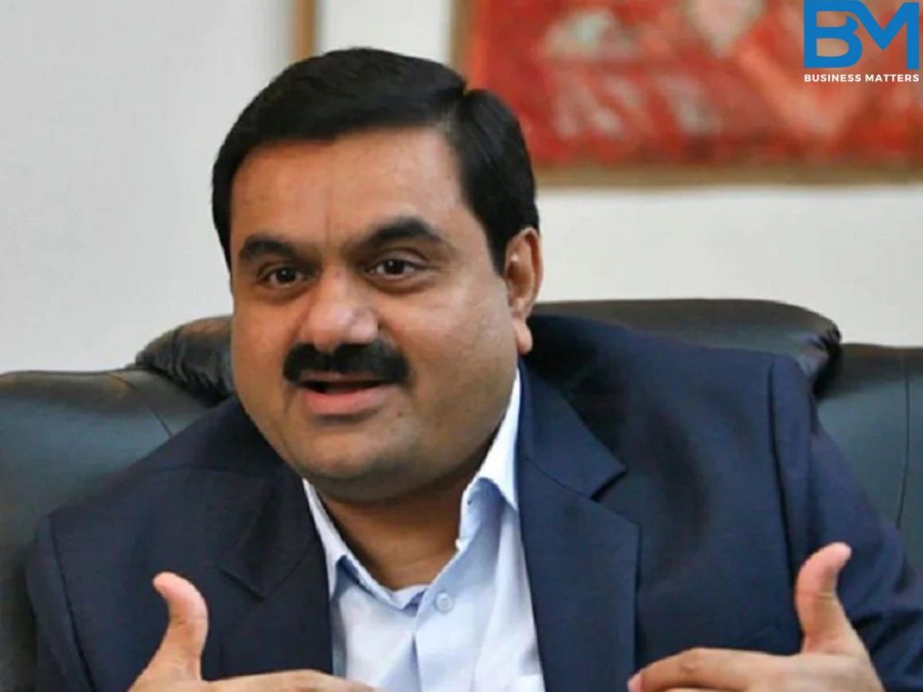 gautam adani explaining while sitting on a couch